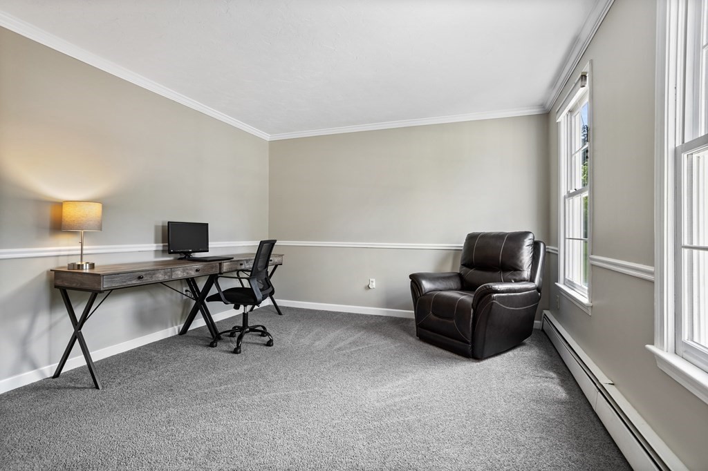 24 Devincent Drive Stow, MA 01775 - Photo 17 of 39 a work room with furniture and a window