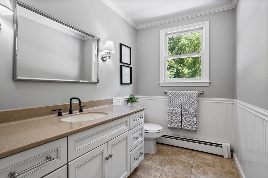 24 Devincent Drive Stow, MA 01775 - Photo 18 of 39 a bathroom with a toilet sink and mirror