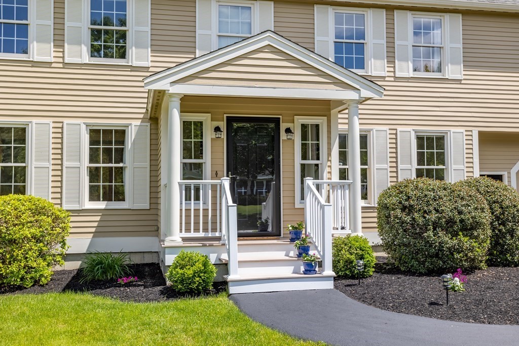 24 Devincent Drive Stow, MA 01775 - Photo 2 of 39 a front view of a house with a yard