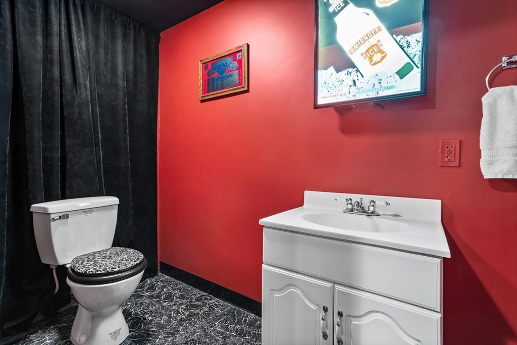 24 Devincent Drive Stow, MA 01775 - Photo 32 of 39 a bathroom with a toilet a sink and a shower