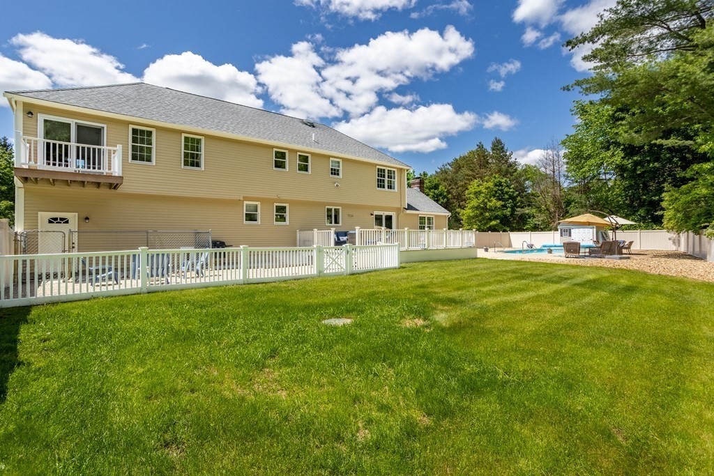 24 Devincent Drive Stow, MA 01775 - Photo 37 of 39 a view of a house with a yard porch and sitting area