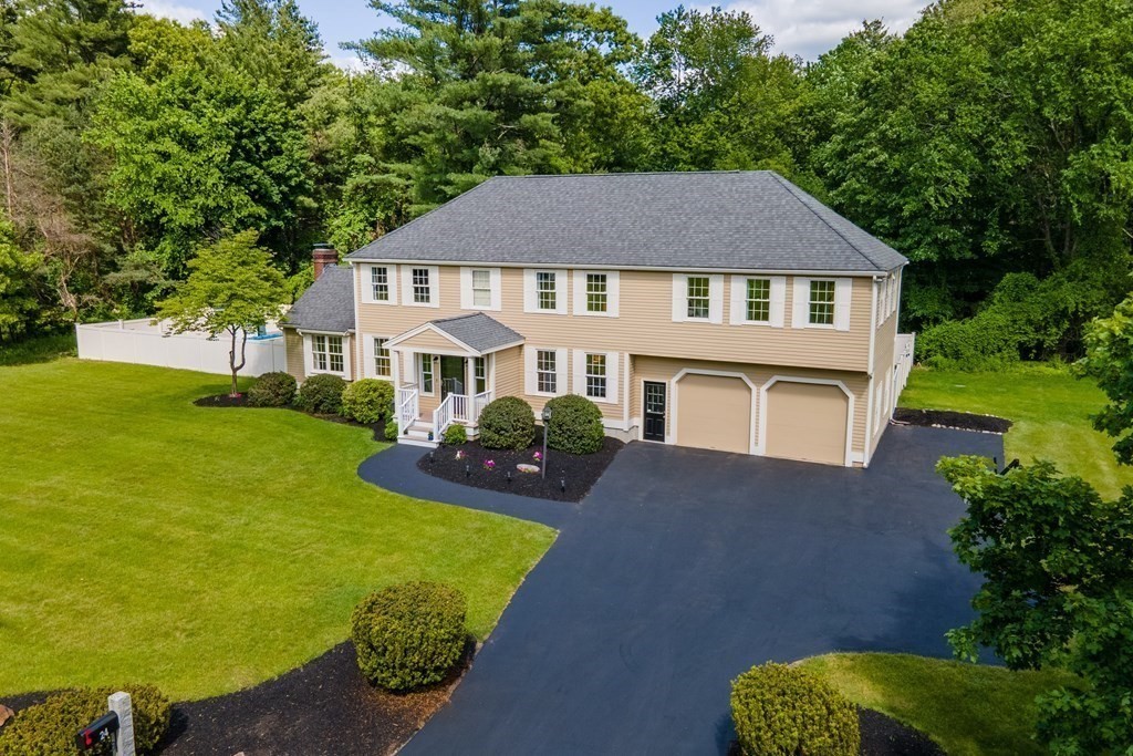 24 Devincent Drive Stow, MA 01775 - Photo 38 of 39 a front view of a house with garden