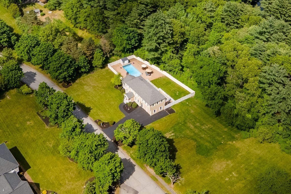24 Devincent Drive Stow, MA 01775 - Photo 39 of 39 an aerial view of a house with a yard and swimming pool