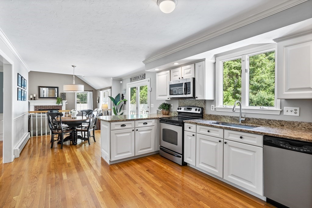 24 Devincent Drive Stow, MA 01775 - Photo 6 of 39 a kitchen with stainless steel appliances granite countertop sink stove top oven and cabinets