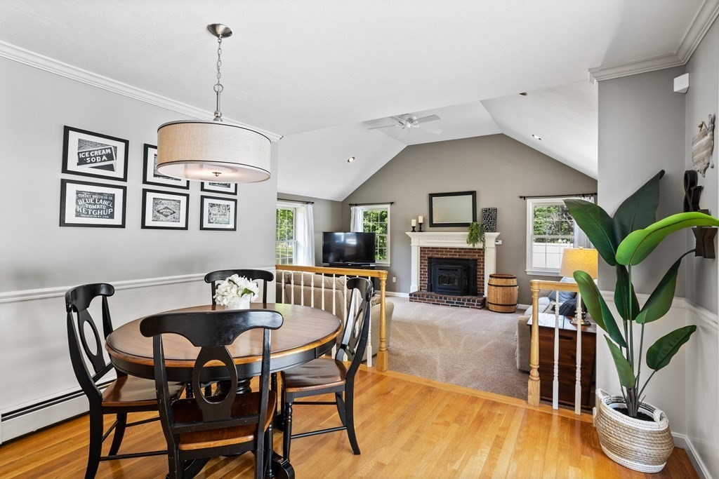 24 Devincent Drive Stow, MA 01775 - Photo 9 of 39 a view of a livingroom with furniture and a fireplace