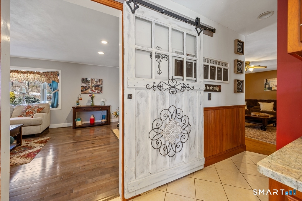 63 Lyman Road Wolcott, CT 06716 - Photo 11 of 70 Barn door from kitchen to living room