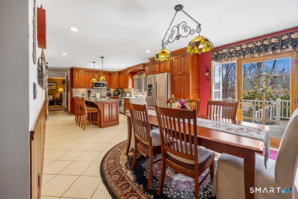 63 Lyman Road Wolcott, CT 06716 - Photo 19 of 70 a view of a dining room with furniture window and wooden floor