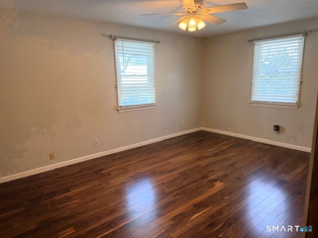 63 Lyman Road Wolcott, CT 06716 - Photo 26 of 70 a view of wooden floor and windows in a room