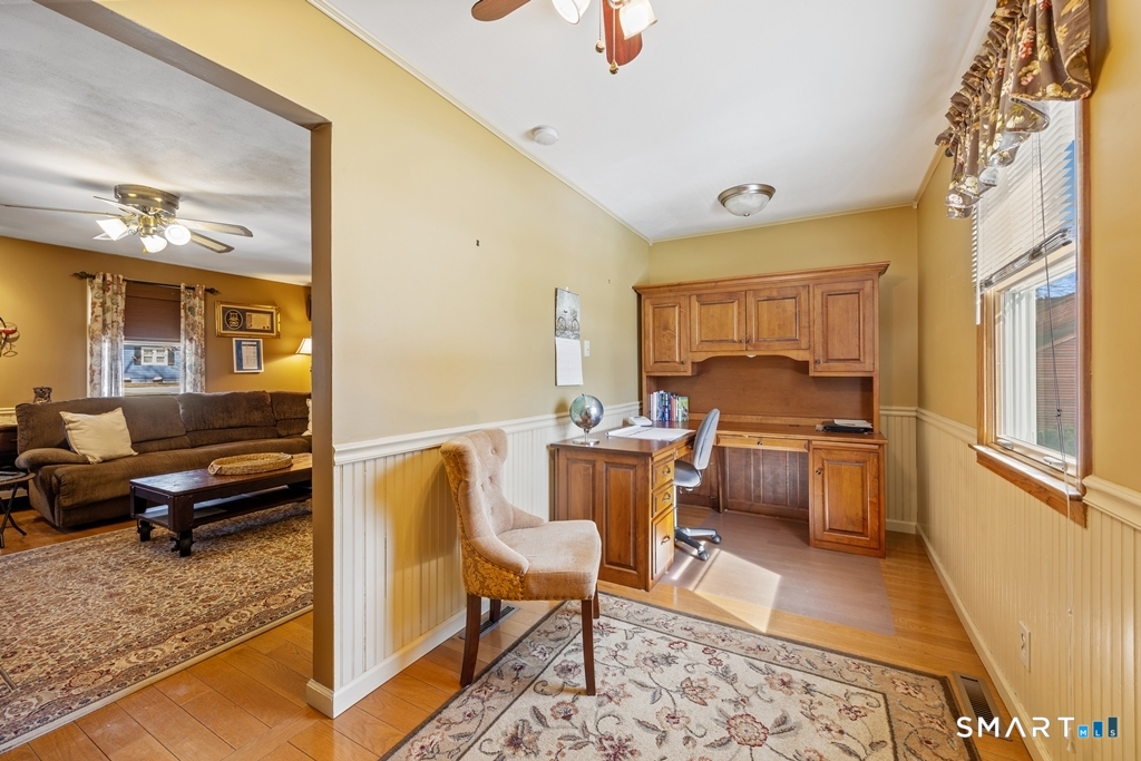 63 Lyman Road Wolcott, CT 06716 - Photo 29 of 70 a living room with a couch and a dining table