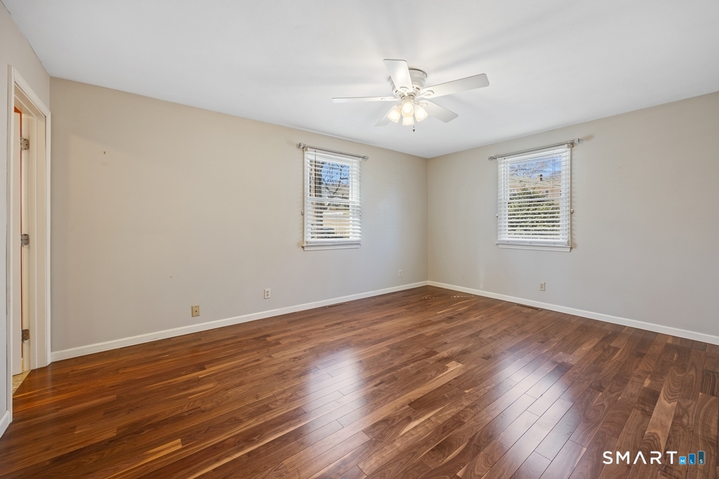 63 Lyman Road Wolcott, CT 06716 - Photo 37 of 70 a view of an empty room with wooden floor and a window