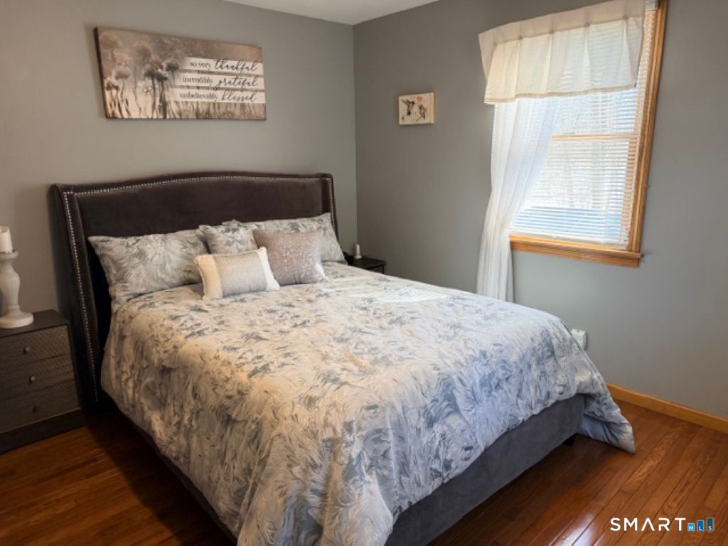 63 Lyman Road Wolcott, CT 06716 - Photo 38 of 70 a large bed sitting in a bedroom next to a window