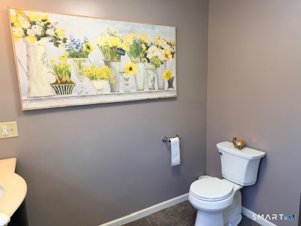 63 Lyman Road Wolcott, CT 06716 - Photo 42 of 70 a white toilet sitting next to a bathroom sink