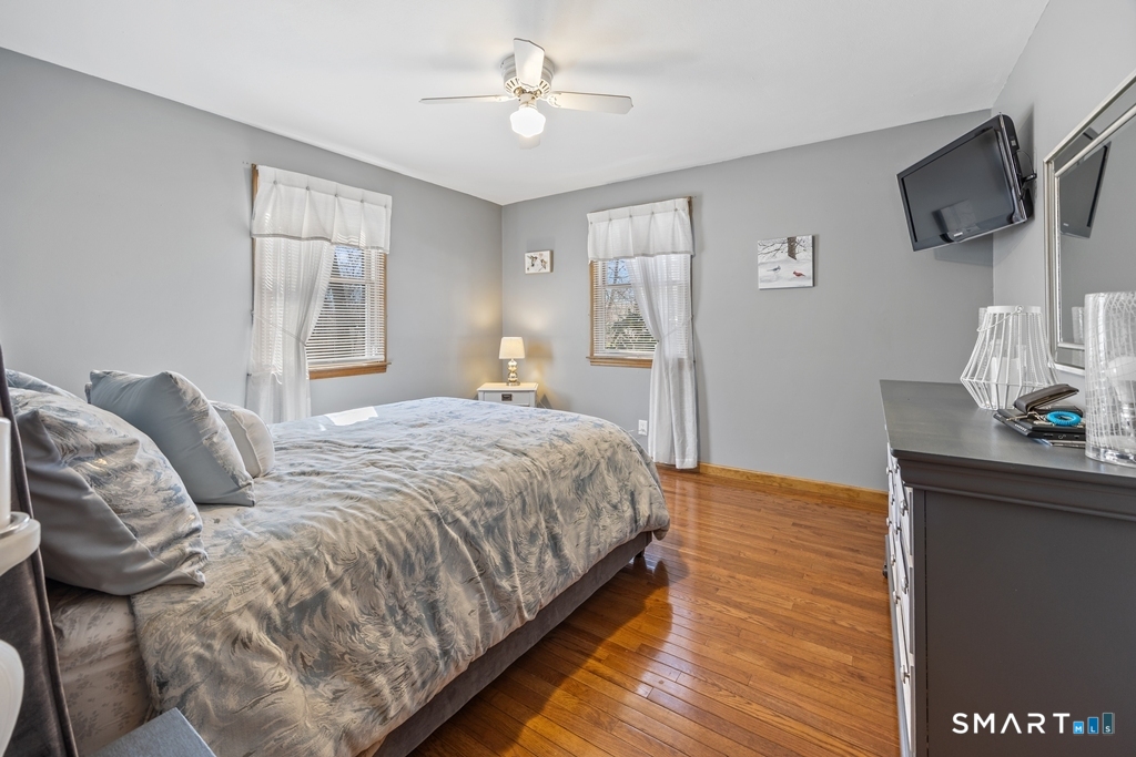 63 Lyman Road Wolcott, CT 06716 - Photo 43 of 70 a bedroom with a bed a flat screen tv and a window