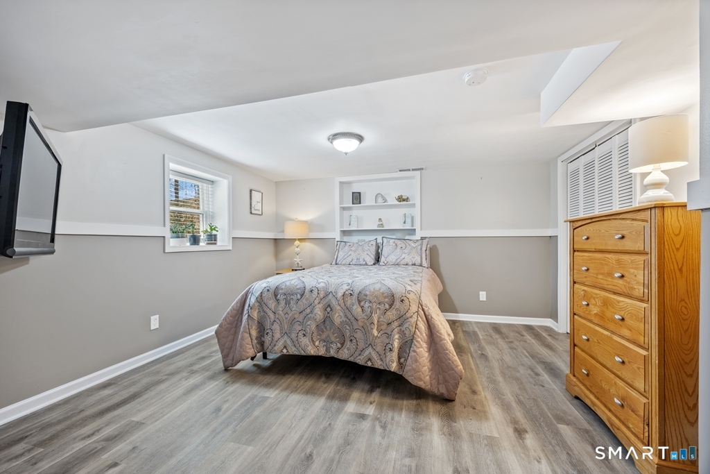 63 Lyman Road Wolcott, CT 06716 - Photo 51 of 70 a bedroom with a bed and a dresser