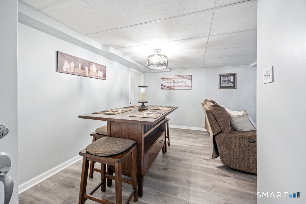 63 Lyman Road Wolcott, CT 06716 - Photo 55 of 70 a view of a dining room with furniture and wooden floor