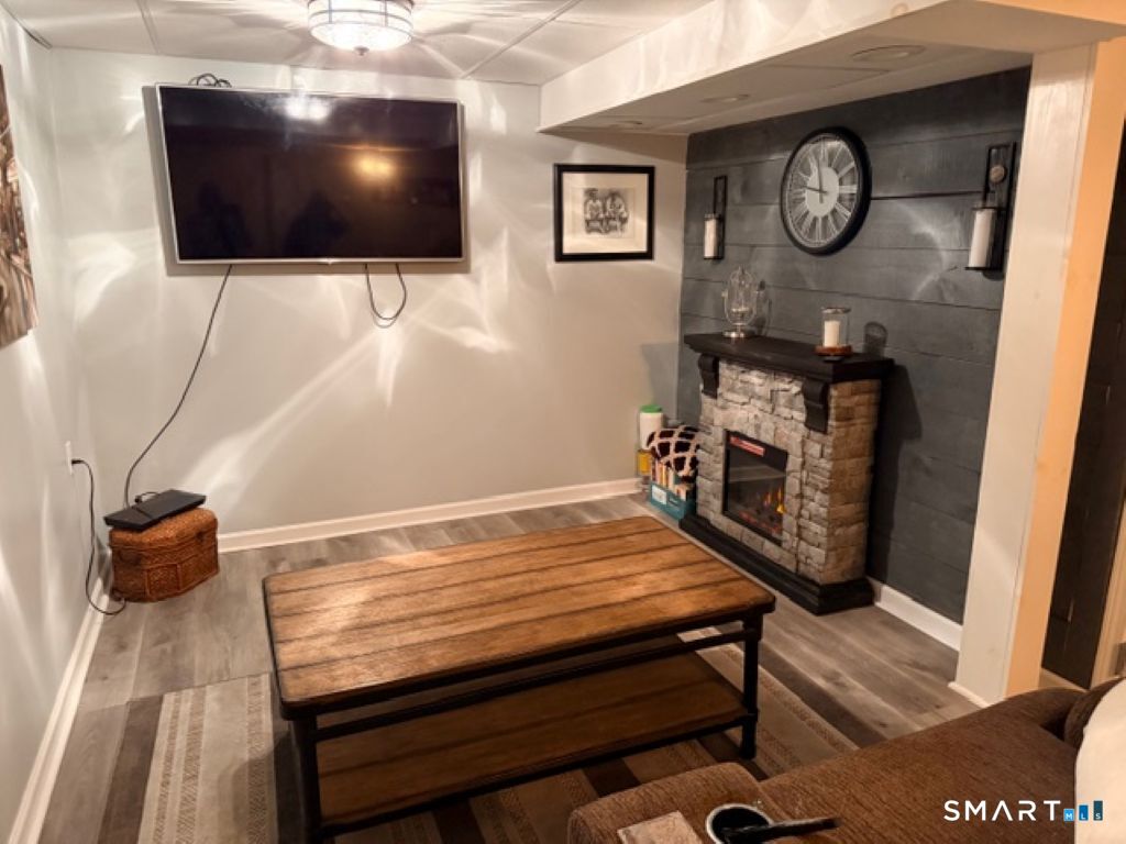 63 Lyman Road Wolcott, CT 06716 - Photo 60 of 70 a view of a livingroom with furniture and wooden floor