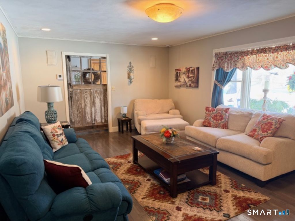 63 Lyman Road Wolcott, CT 06716 - Photo 6 of 70 a living room with furniture and a large window