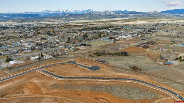 an aerial view of residential building and parking space