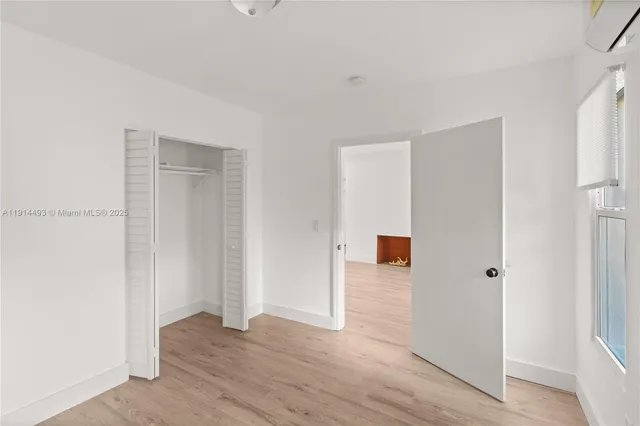 a view of a livingroom with wooden floor