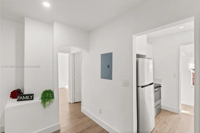 a bathroom with a toilet a sink and shower