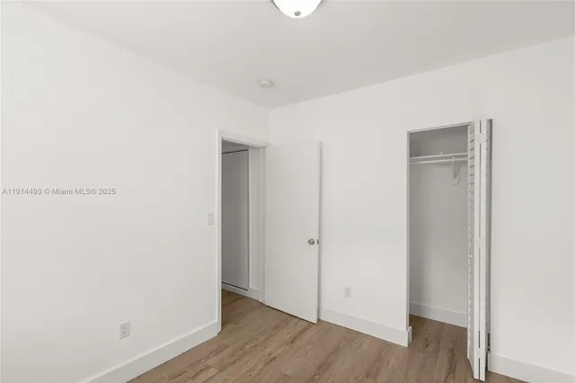 a view of cabinets and wooden floor