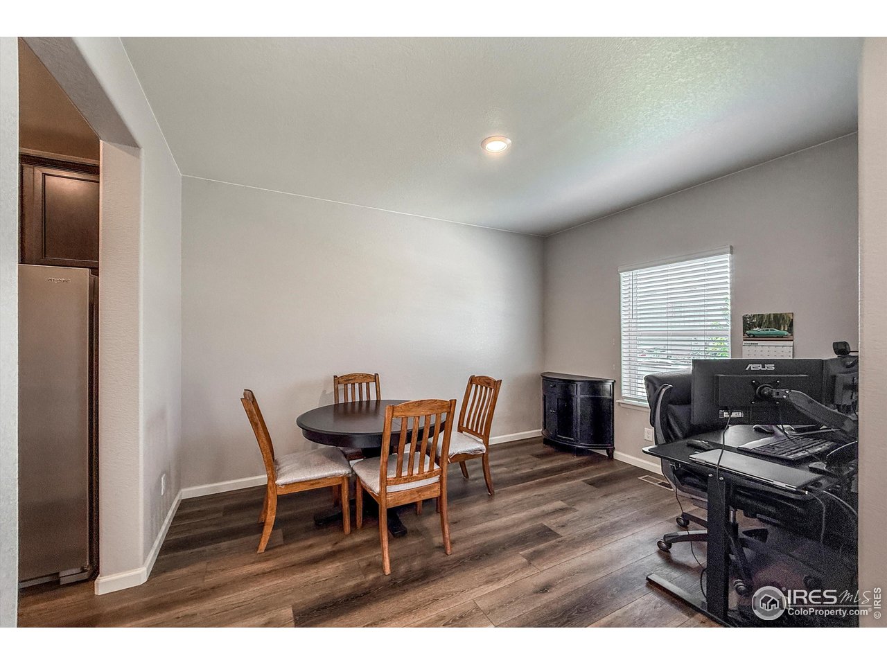 2287 Murray Street Mead, CO 80542 - Photo 13 of 38 a dining room with furniture and wooden floor
