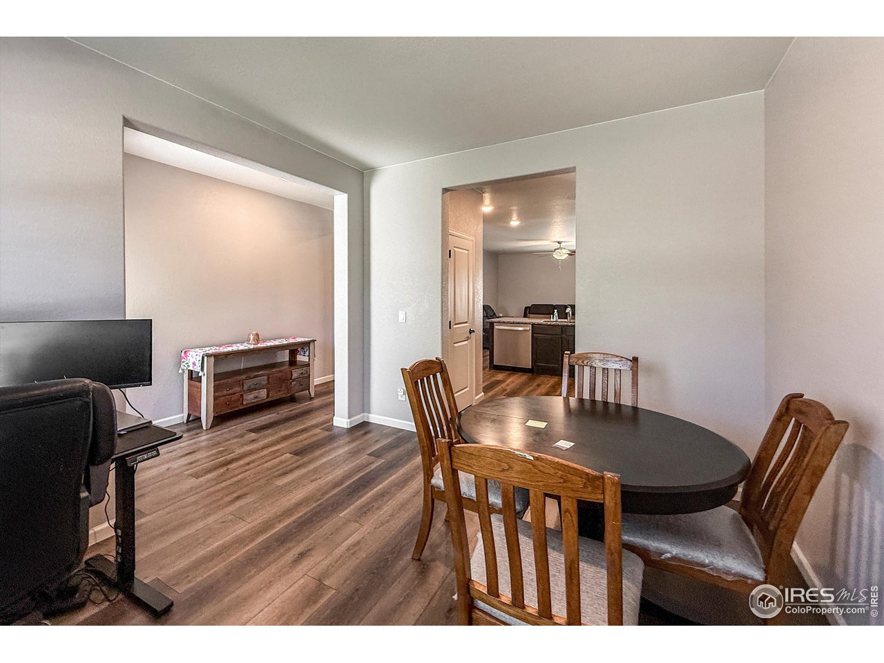 2287 Murray Street Mead, CO 80542 - Photo 14 of 38 a view of a dining room with furniture and wooden floor