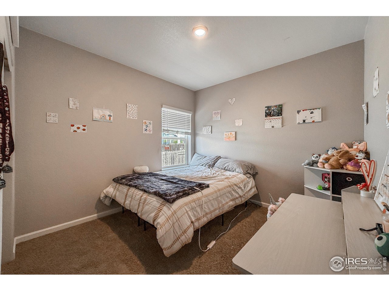 2287 Murray Street Mead, CO 80542 - Photo 20 of 38 a bedroom with a bed and a lamp