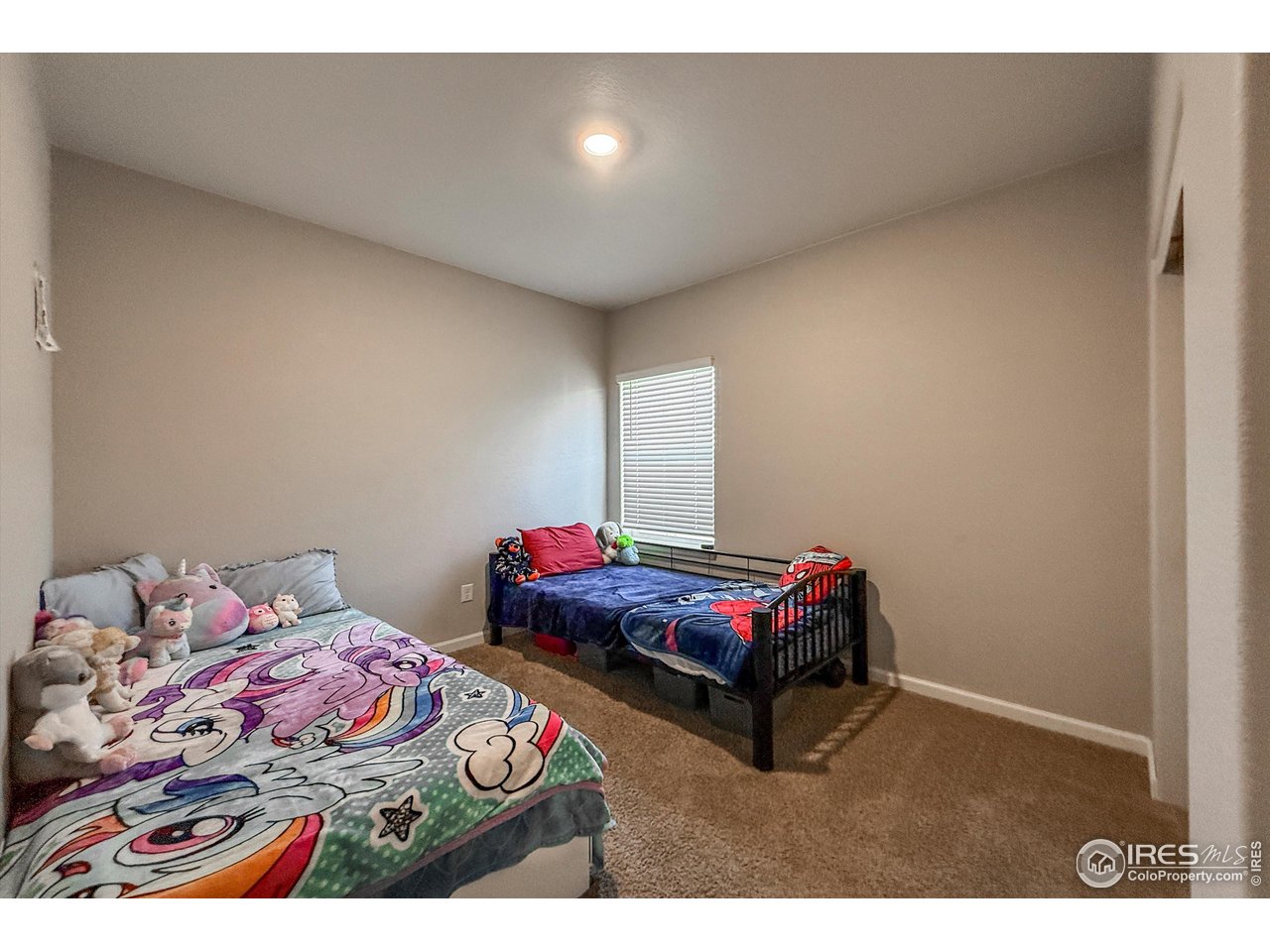 2287 Murray Street Mead, CO 80542 - Photo 22 of 38 a bedroom with bed and a window