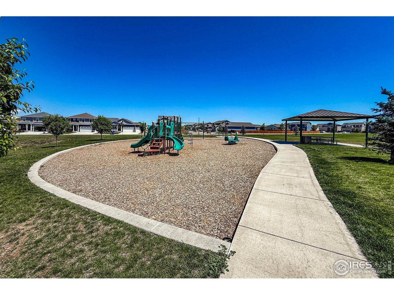 2287 Murray Street Mead, CO 80542 - Photo 38 of 38 a view of a swimming pool with a yard and mountain view