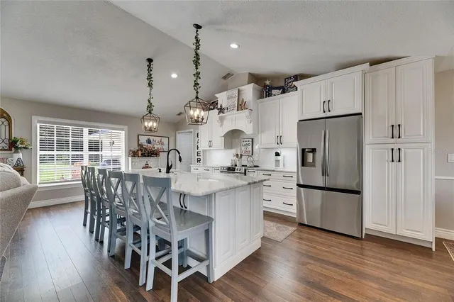 a spacious bathroom with a granite countertop sink a mirror and a