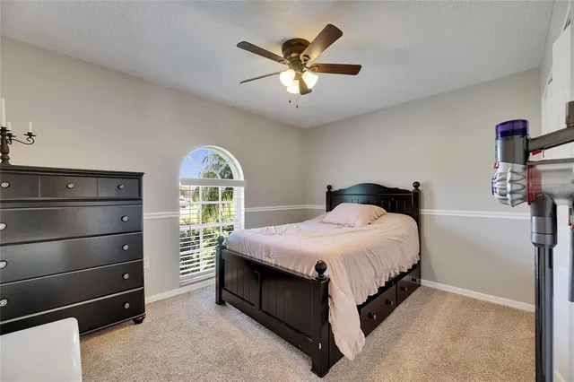 a view of a porch with a table and chairs