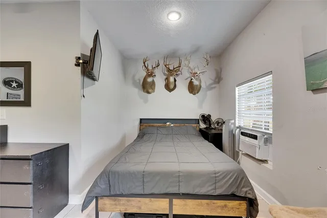 a living room with furniture a rug and a chandelier