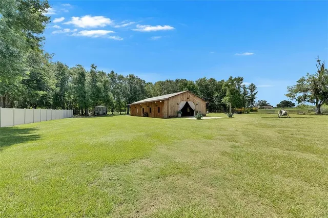 a living room with furniture and a chair