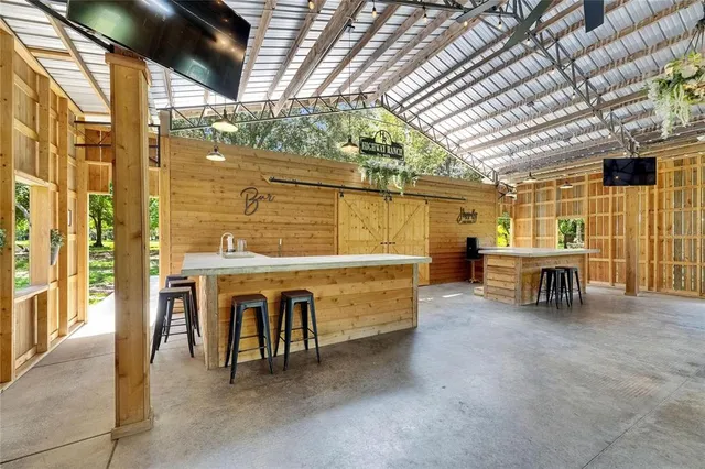 a aerial view of a house with a yard