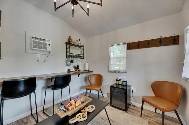 a kitchen with a sink a refrigerator and window