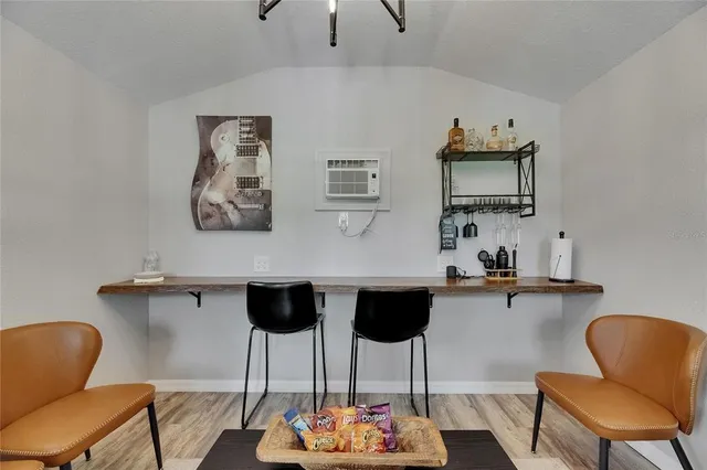 a kitchen with granite countertop a sink stove and cabinets