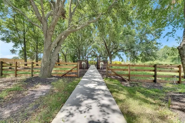 a kitchen with granite countertop a sink and cabinets