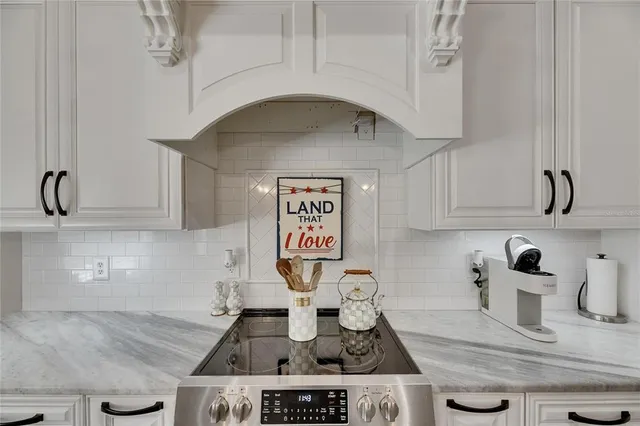 a large kitchen with a table and chairs