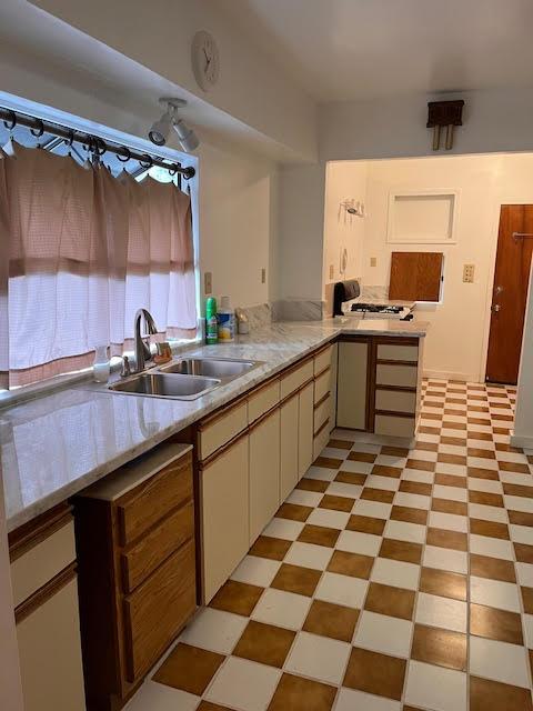 61 East Ellis Street Stockton, CA 95204 - Photo 7 of 15 a kitchen with a sink a stove and a microwave