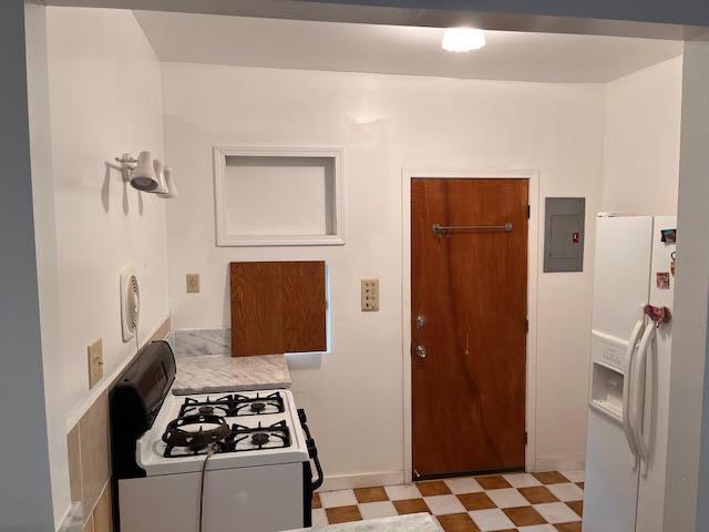 61 East Ellis Street Stockton, CA 95204 - Photo 8 of 15 a kitchen with a stove and a refrigerator