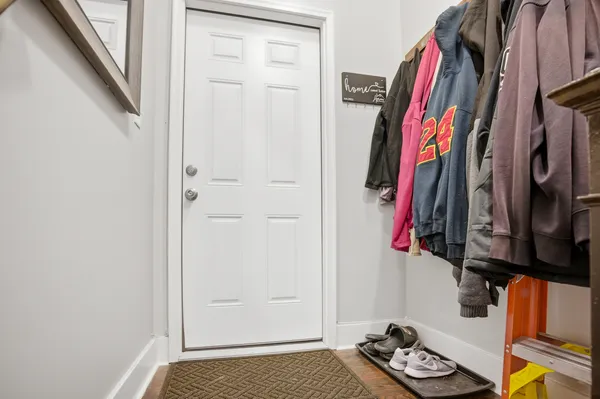a view of walk in closet with clothes and shoes