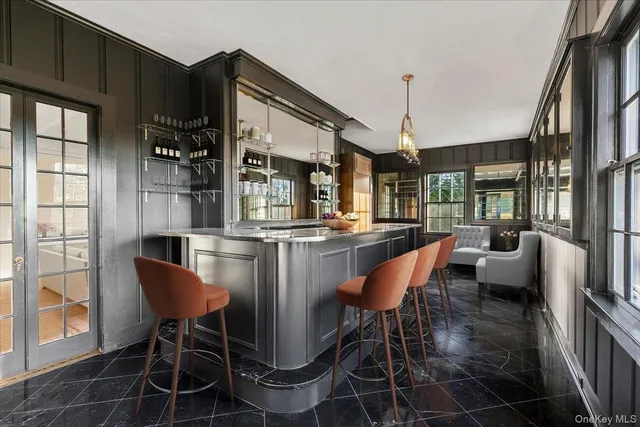 a kitchen with a sink a stove a microwave and cabinets