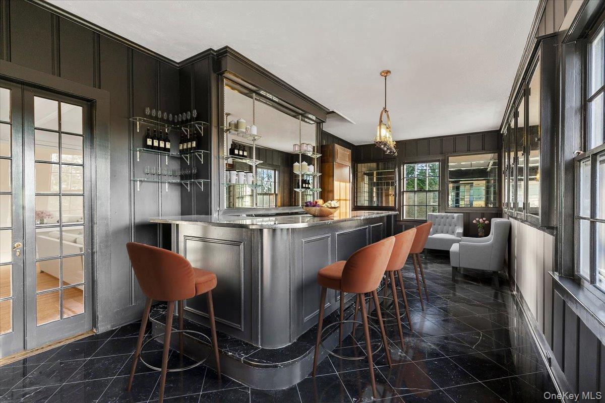 83 Somerstown Road Ossining, NY 10562 - Photo 11 of 38 a dining room with furniture a chandelier and wooden floor