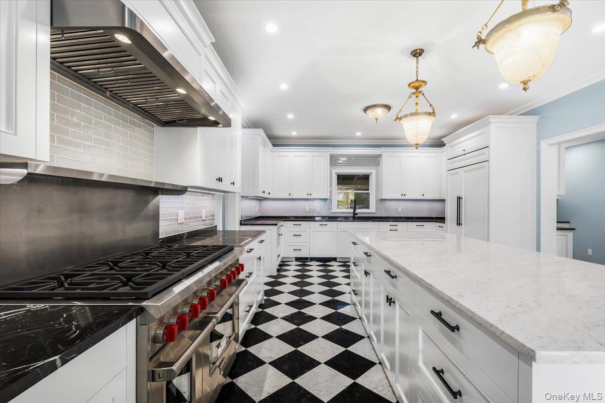 83 Somerstown Road Ossining, NY 10562 - Photo 14 of 38 a kitchen with stainless steel appliances granite countertop a sink and cabinets