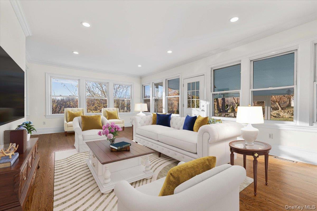 83 Somerstown Road Ossining, NY 10562 - Photo 16 of 38 a living room with furniture and a flat screen tv