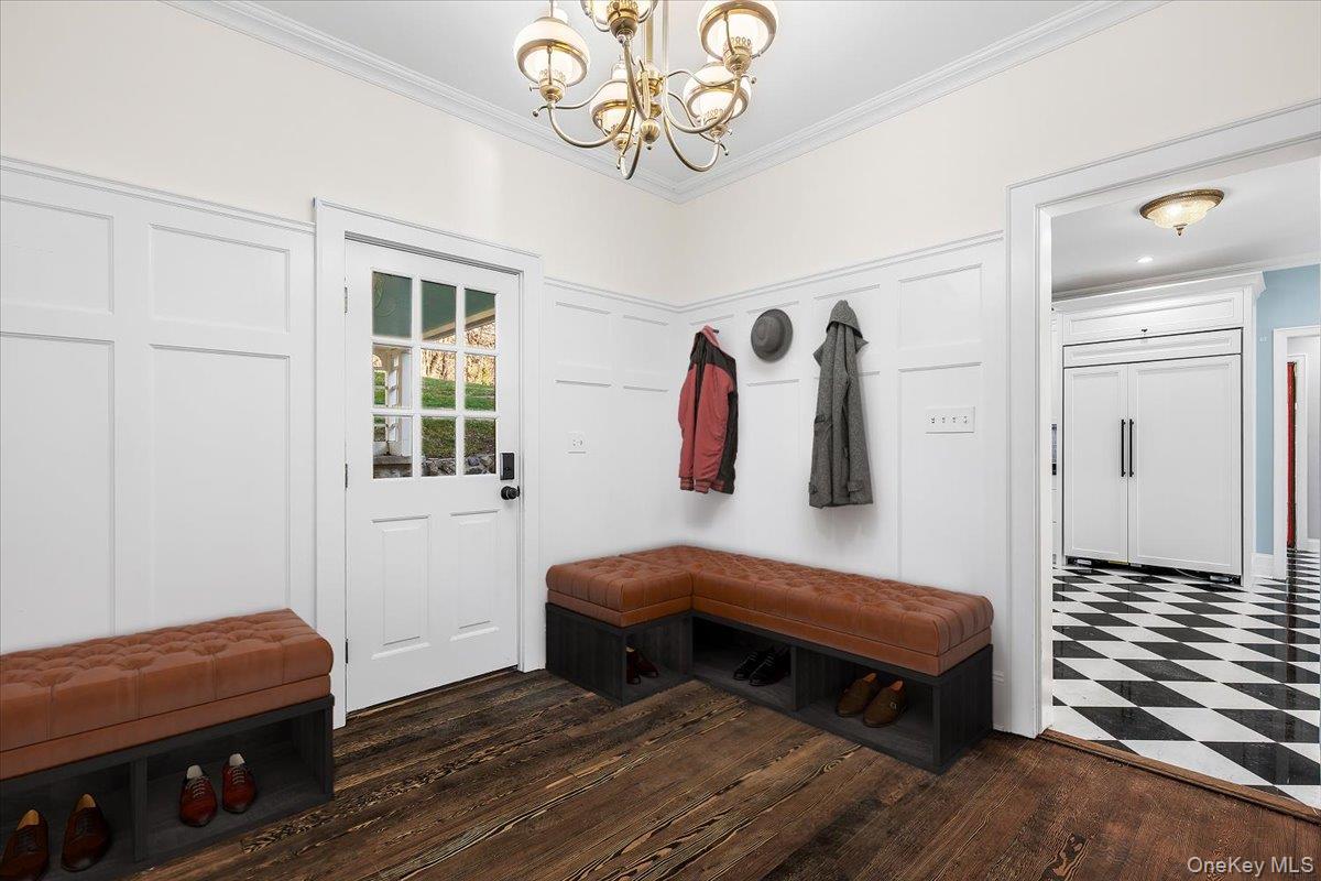 83 Somerstown Road Ossining, NY 10562 - Photo 17 of 38 a bedroom with a bed and a chandelier