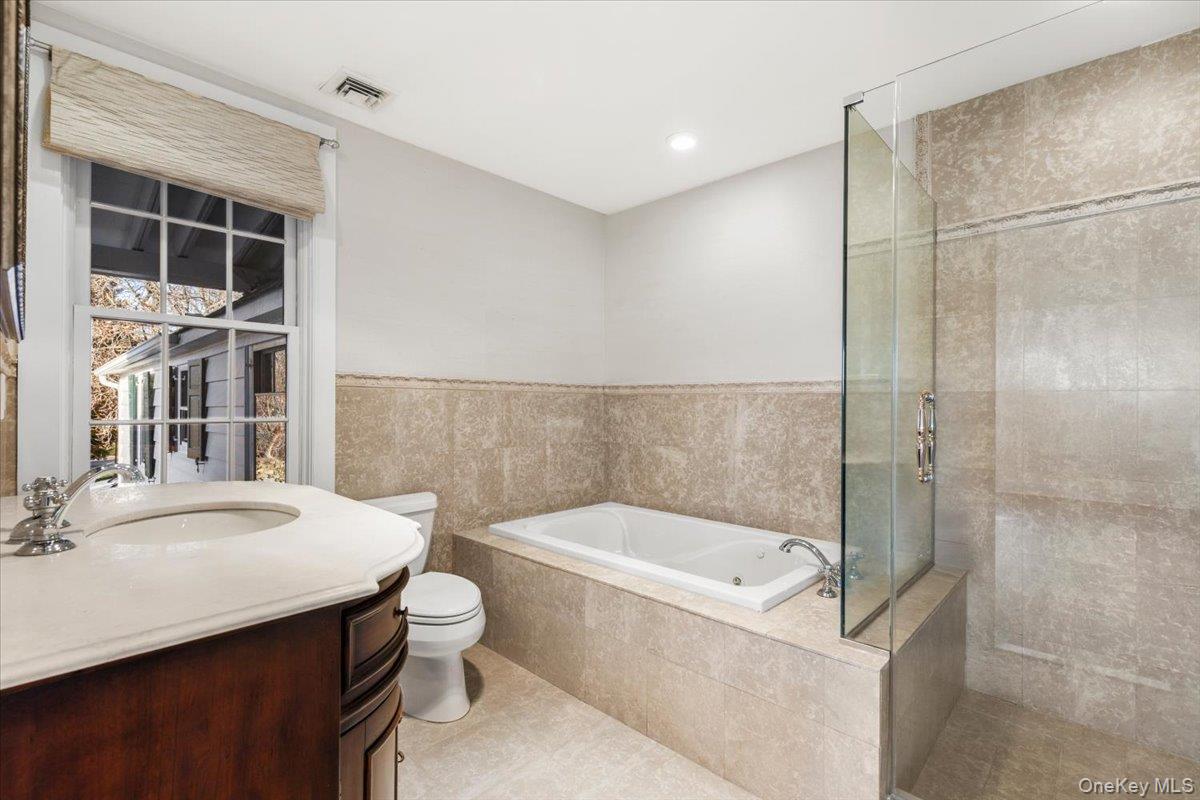 83 Somerstown Road Ossining, NY 10562 - Photo 19 of 38 a bathroom with a bathtub and a sink