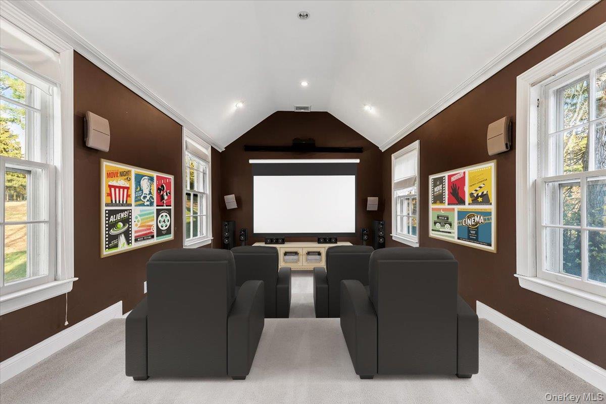 83 Somerstown Road Ossining, NY 10562 - Photo 23 of 38 a living room with large couches bookshelf and a large window