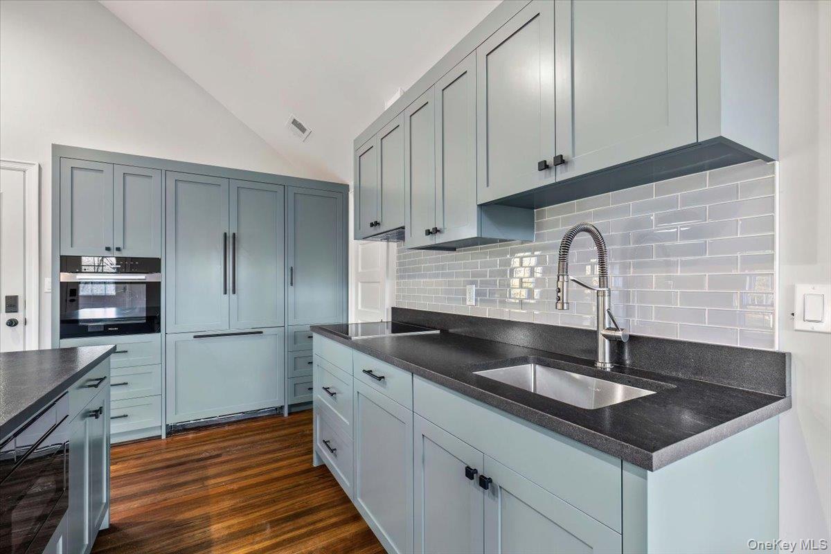 83 Somerstown Road Ossining, NY 10562 - Photo 31 of 38 a kitchen with granite countertop a sink stainless steel appliances and cabinets